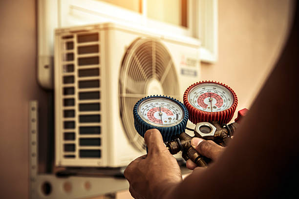 Professional Air Conditioning Service technician working in Armonk, NY